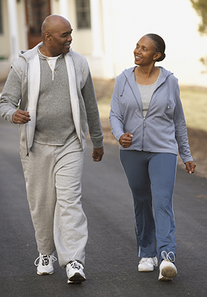 Middle-aged man and woman walking.